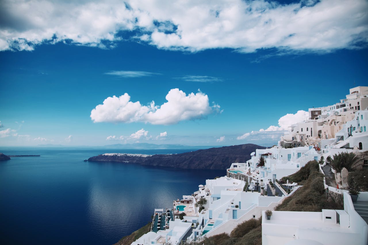 portfolio-03 Breathtaking panoramic view of Santorinis white-washed architecture against the deep blue sea.