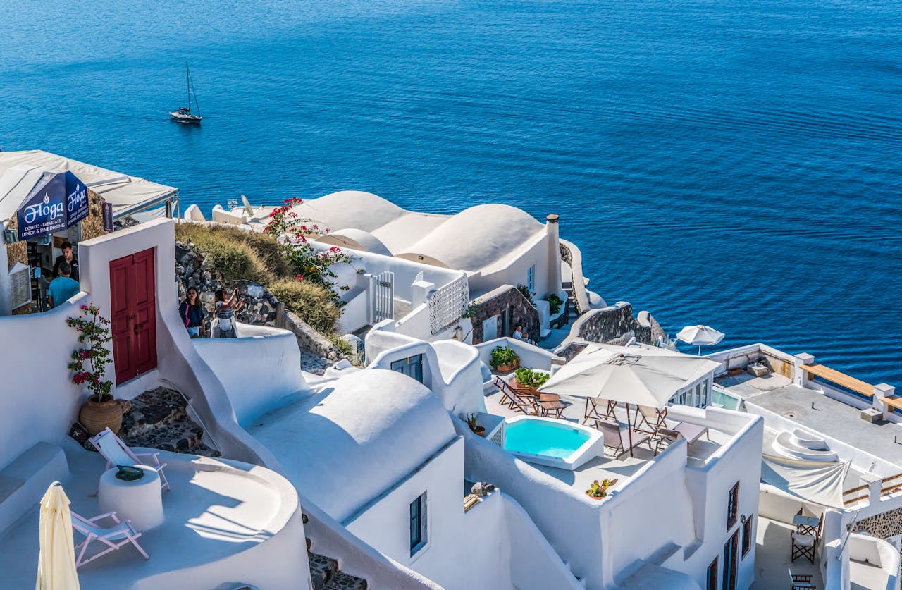 portfolio-05 Whitewashed Santorini architecture overlooking the deep blue Aegean Sea.